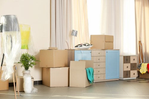 Careful unloading of boxes and furniture at a new East Finchley home