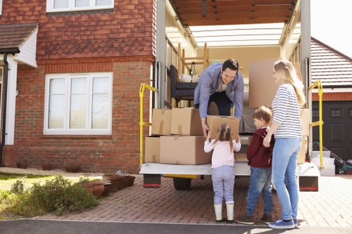 Removal van and moving boxes in an Eastfinchley residential street