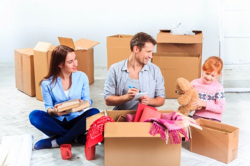 Careful wrapping of fragile household items during packing