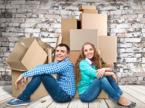 Loading furniture and boxes into a van for an East Finchley home move