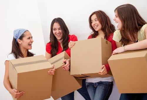 Securely stacked moving boxes and wrapped furniture inside a van