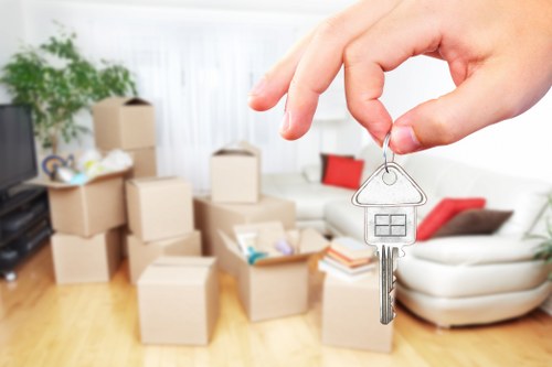 Packed office furniture and equipment prepared for a local business move