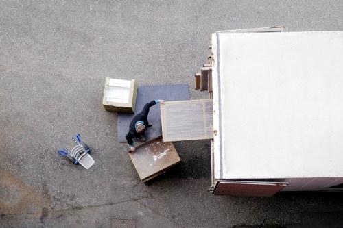 Local removal helper transporting boxes and furniture in East Finchley