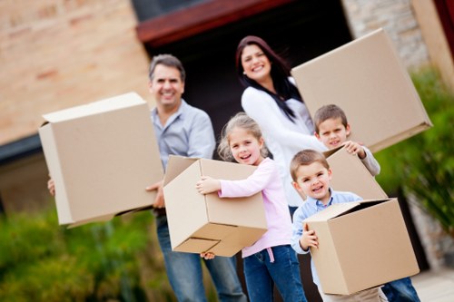 Packed household items and moving equipment ready for loading