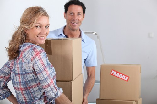 Professional movers loading furniture for a North London home move