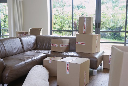 Local removal team organising packed boxes in East Finchley